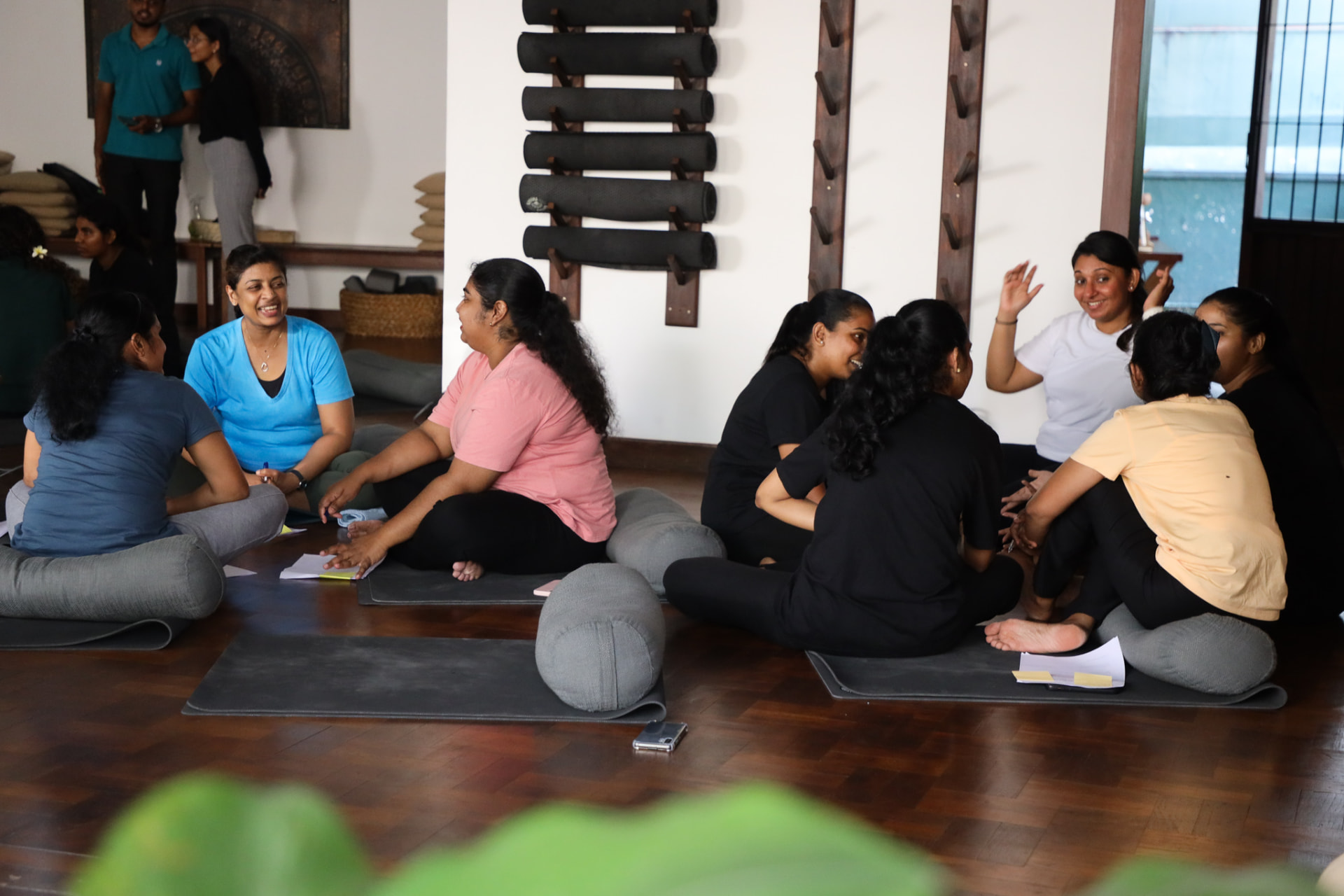 A team seated in a circle mid-workshop