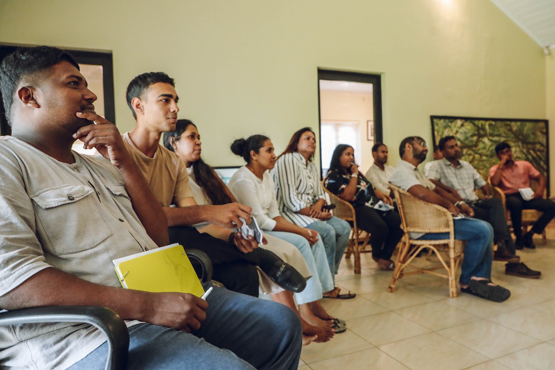 Team members listening attentively during a workshop session