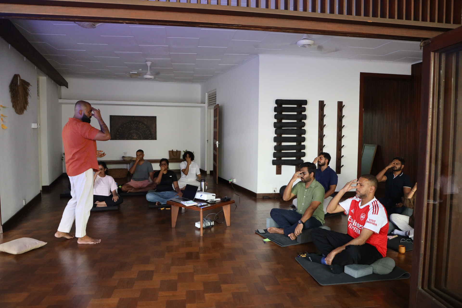 A live Nerv session, group mid-practice in a warm-lit room